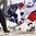 GRAND FORKS, NORTH DAKOTA - APRIL 21: Finland's Aapeli Rasanen #22 and Russia's Mikhail Bitsadz #9 face-off during quarterfinal round action at the 2016 IIHF Ice Hockey U18 World Championship. (Photo by Minas Panagiotakis/HHOF-IIHF Images)

